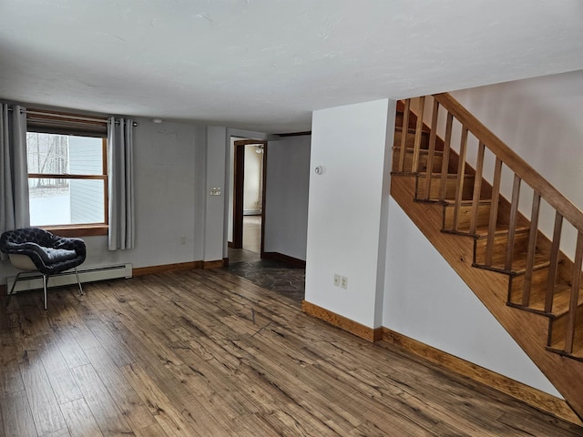 interior space with baseboard heating and dark wood-type flooring