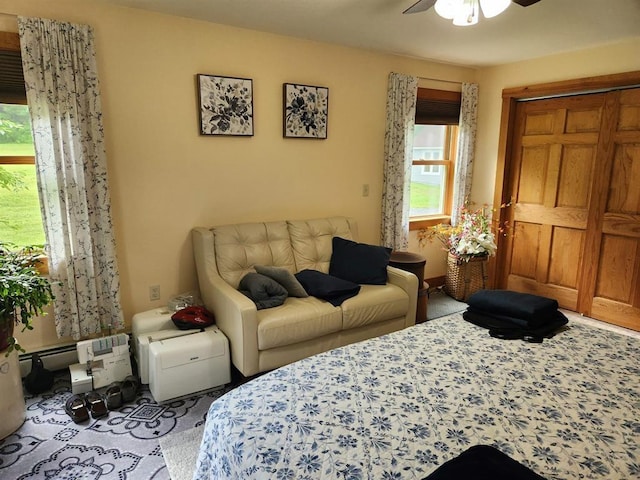 bedroom featuring ceiling fan and a closet