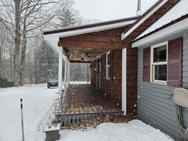 exterior space featuring ceiling fan