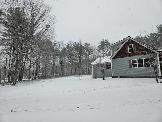 view of yard layered in snow