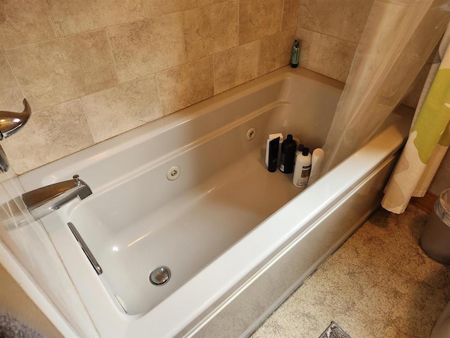 bathroom featuring a tub to relax in