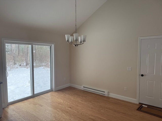 unfurnished dining area with an inviting chandelier, vaulted ceiling, baseboard heating, and light hardwood / wood-style flooring