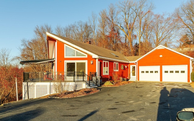 view of front of house featuring a porch and a garage