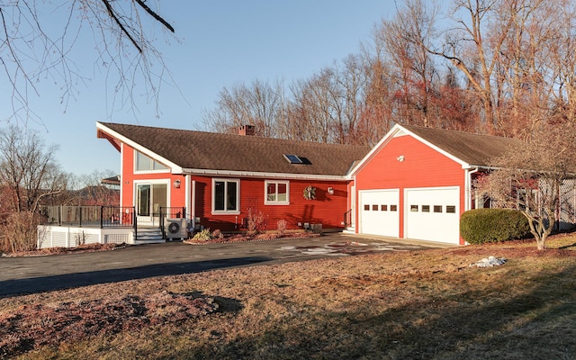 single story home featuring a garage