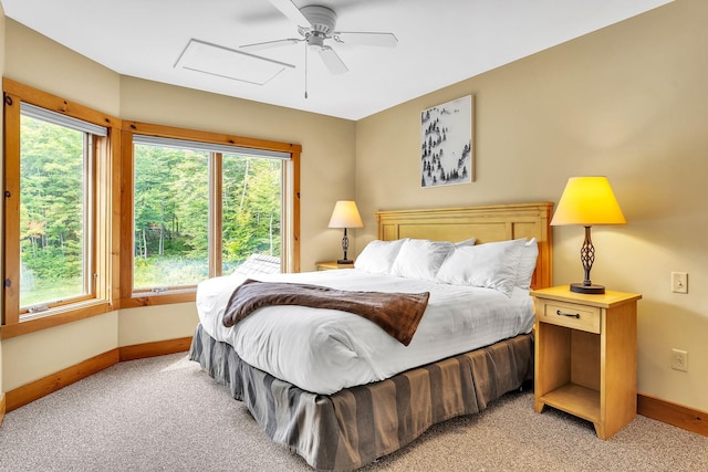 bedroom featuring light colored carpet and ceiling fan