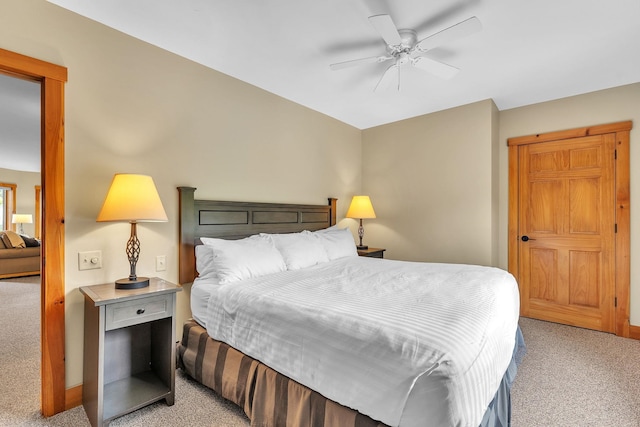 carpeted bedroom with ceiling fan