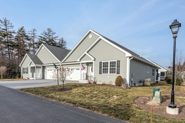 view of front facade with a garage and a front lawn