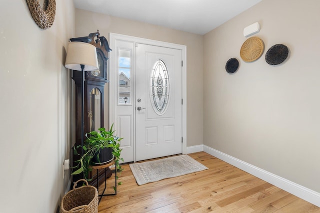 foyer entrance with light hardwood / wood-style floors