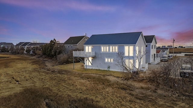 view of back house at dusk