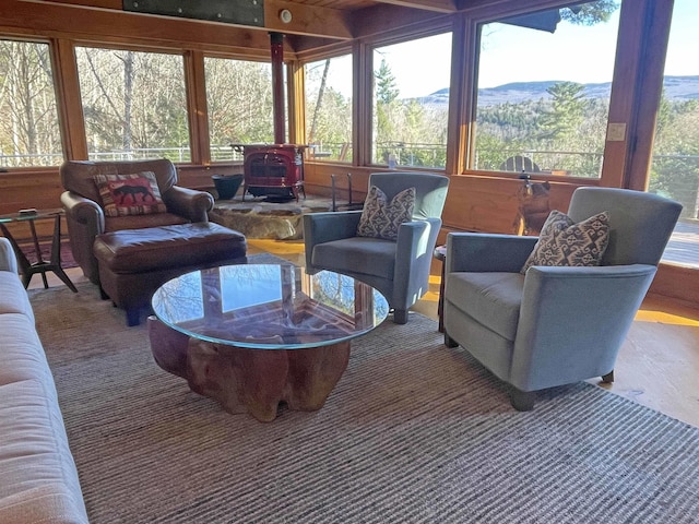 sunroom with a wood stove