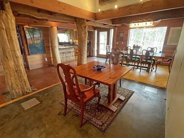 dining area with concrete flooring