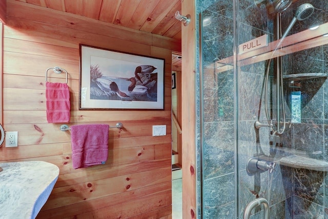 bathroom with wooden ceiling, an enclosed shower, and wooden walls