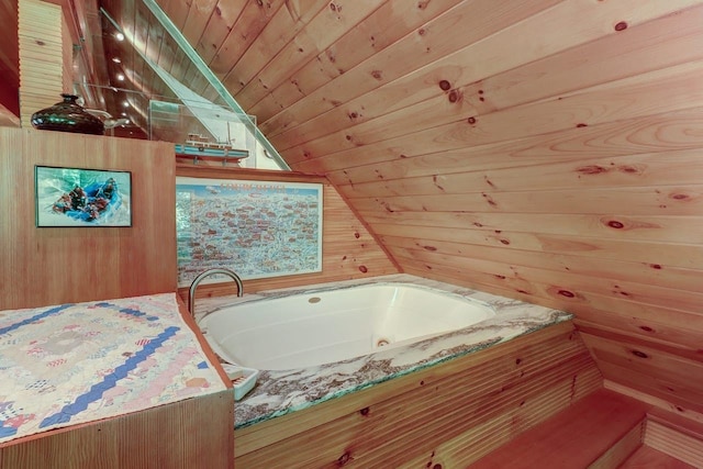 bathroom featuring vaulted ceiling, a bathtub, wood walls, and wood ceiling