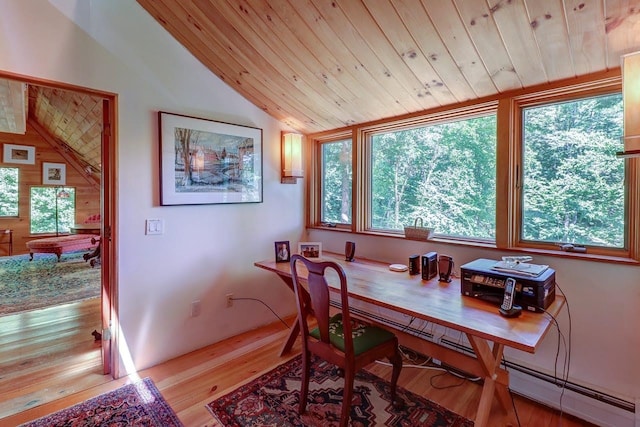 dining room featuring light hardwood / wood-style flooring, wood ceiling, vaulted ceiling, and a baseboard heating unit