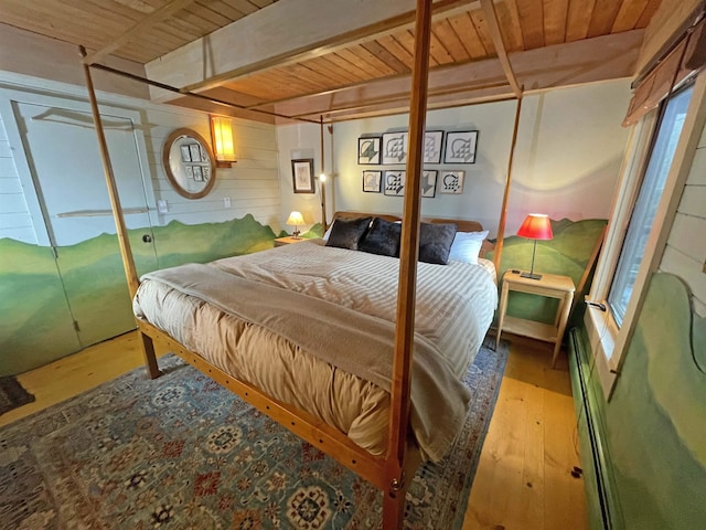 bedroom featuring hardwood / wood-style floors and wooden ceiling