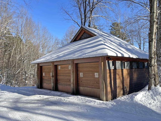 view of snow covered garage