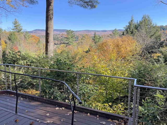 wooden deck with a mountain view