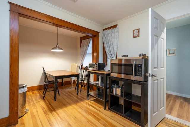 interior space with crown molding and wood-type flooring