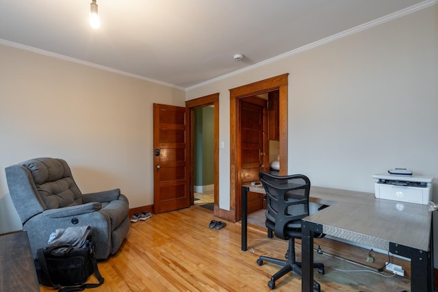 office with wood-type flooring and crown molding