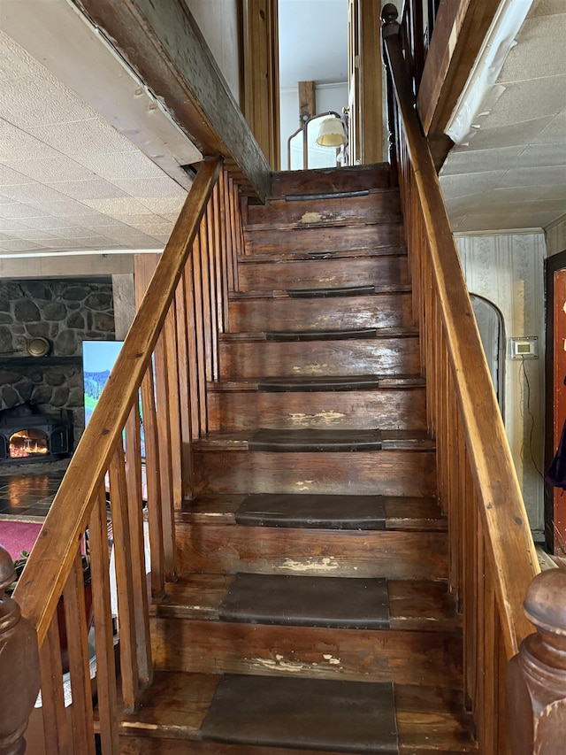 stairs featuring wooden walls