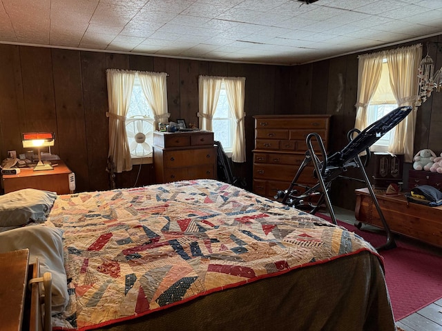 bedroom with wooden walls