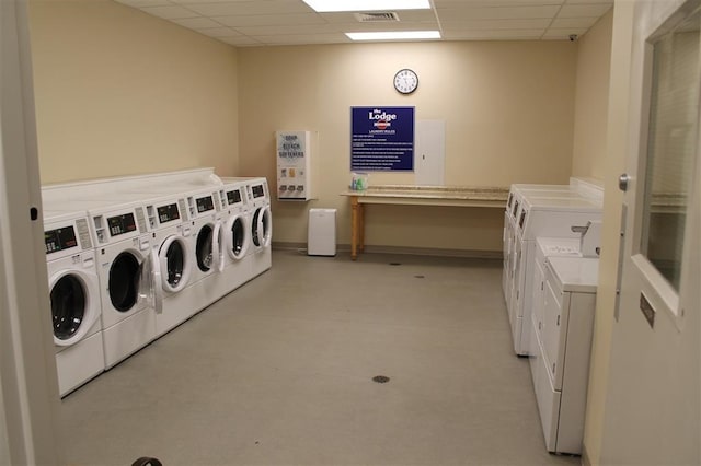 clothes washing area featuring washing machine and dryer