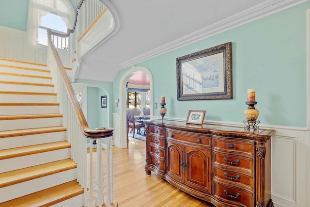 interior space featuring wood-type flooring and crown molding