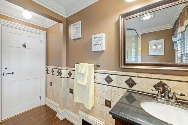 bathroom featuring tile walls, vanity, and ornamental molding