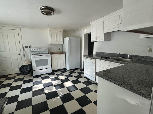 kitchen with sink, white cabinets, and white appliances