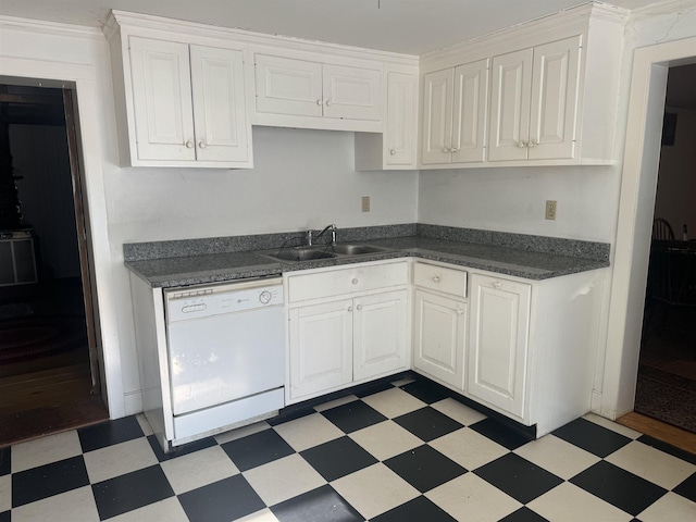 kitchen with white cabinets, dishwasher, and sink