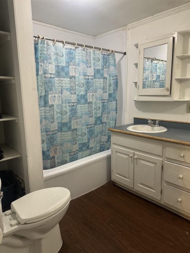 full bathroom featuring ornamental molding, vanity, shower / bath combo with shower curtain, hardwood / wood-style floors, and toilet