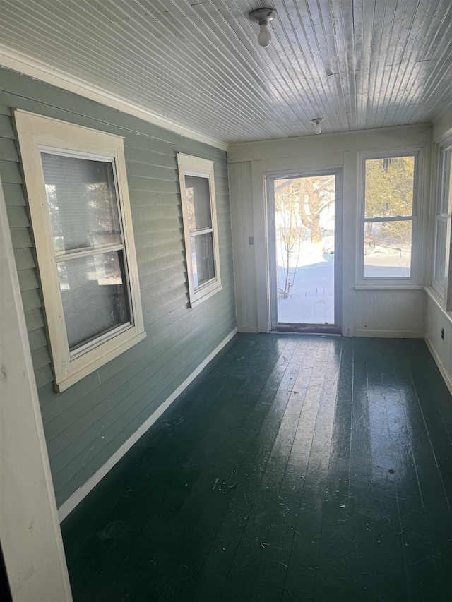 unfurnished sunroom featuring wooden ceiling