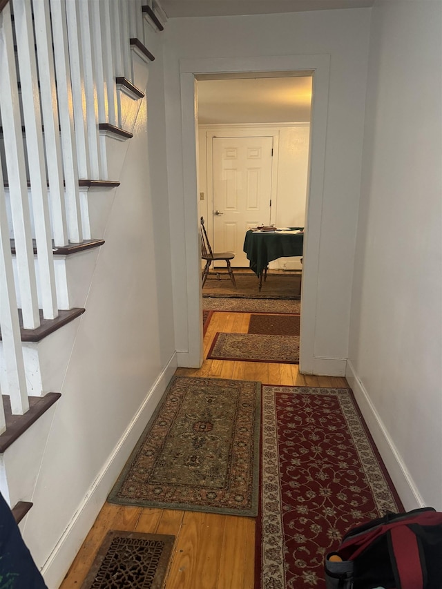 corridor with light hardwood / wood-style flooring