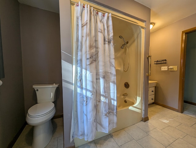 full bathroom with tile patterned floors, vanity, toilet, and shower / bath combo with shower curtain