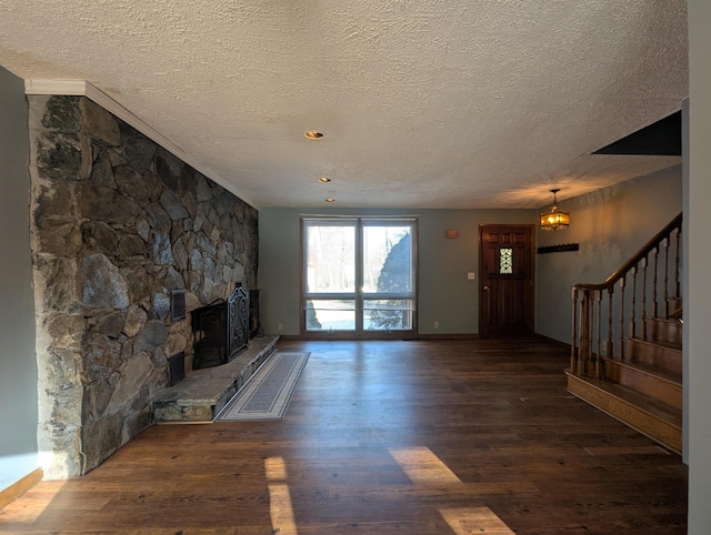 unfurnished living room with dark hardwood / wood-style flooring