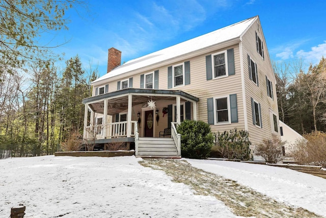 colonial home with a porch