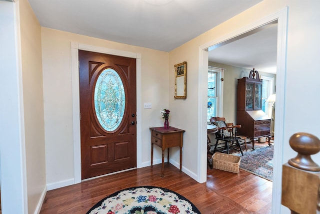 entryway with dark wood-type flooring