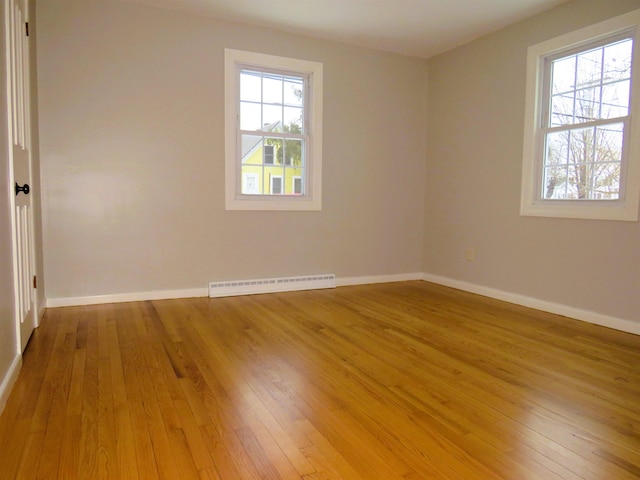 spare room featuring light wood-type flooring