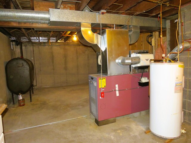 basement with heating unit and water heater