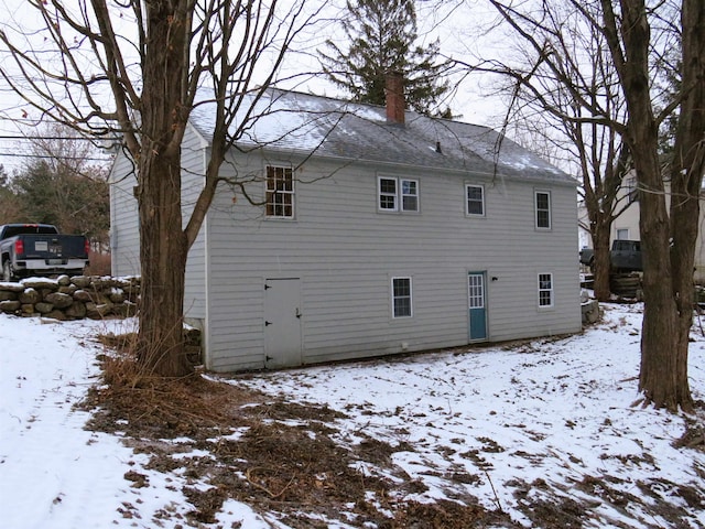 view of snow covered house