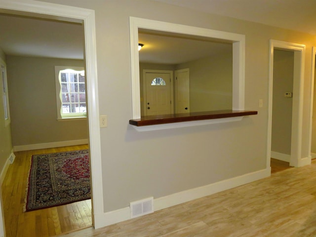 corridor featuring hardwood / wood-style flooring