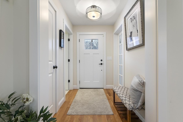 entryway with light hardwood / wood-style flooring