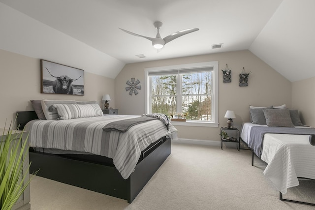 bedroom with ceiling fan, light carpet, and vaulted ceiling