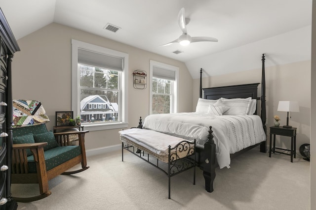 carpeted bedroom with vaulted ceiling and ceiling fan