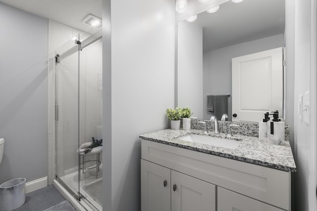 bathroom with vanity and walk in shower