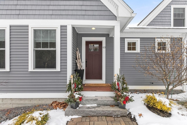 view of snow covered property entrance