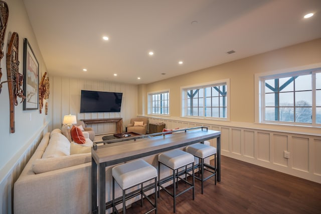 living room with dark hardwood / wood-style floors