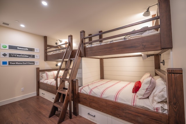 bedroom featuring dark hardwood / wood-style flooring