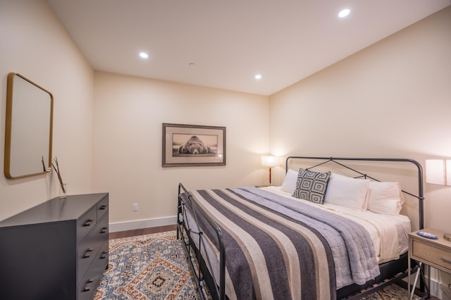 bedroom featuring dark hardwood / wood-style flooring