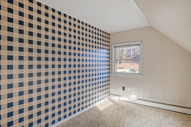 additional living space featuring carpet flooring and vaulted ceiling